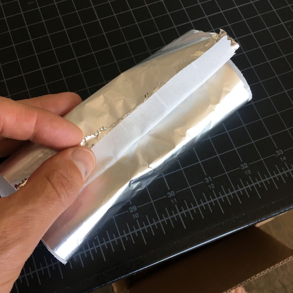 paper folded around bar